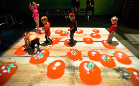 Children step on virtual tomatoes in an interactive video effect game room at Sioux City's LaunchPAD Children's Museum. Allowing kids to become part of a virtual reality video game, the new FX Game Zone is open from 3:30 to 4:30 p.m. weekdays  and may be rented for special occasions. 
Justin Wan, Sioux City Journal